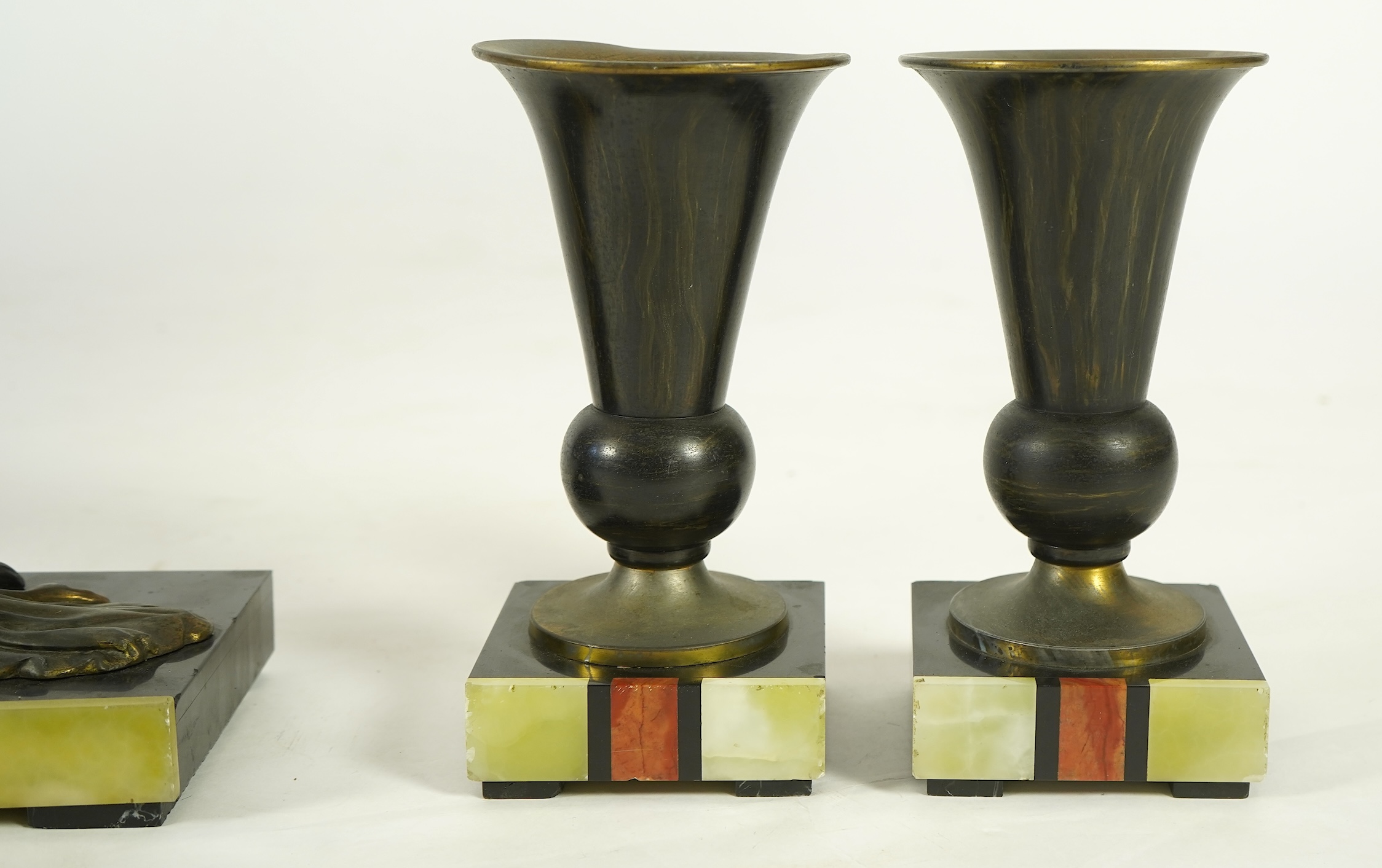 Attributed to Uriano (Ugo Cipriani, Italian, 1897-1960), a Belgian black marble, Rosso red marble and green onyx clock garniture
